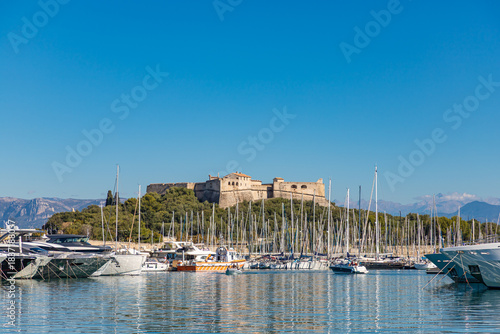 ANTIBES, FRANCE - SEPTEMBER 29, 2025: View of the famous Fort Carré and yachts at the Port Vauban in Antibes, France.
