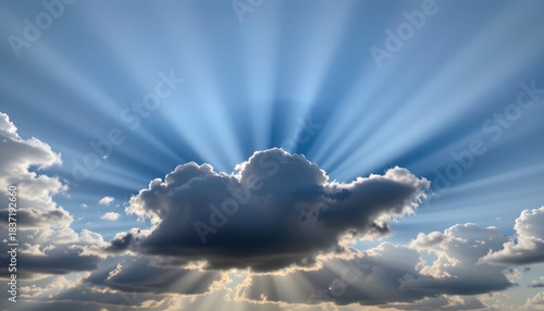 Dramatic Cloud Formation with Rays of Sunlight Breaking Through the Blue Sky