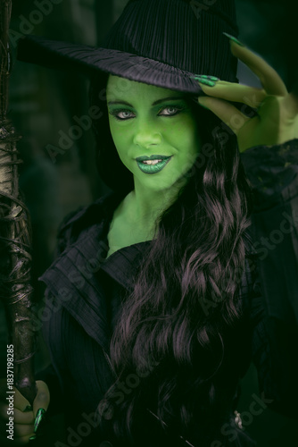 Close up potrait of a pretty girl cosplayer dressed as The Wicked Witch of The West Elphaba Thropp
