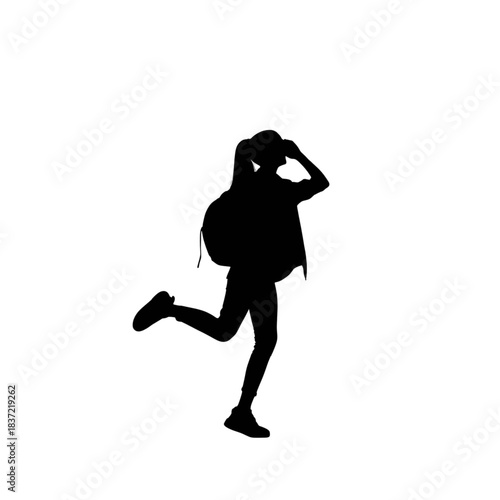 Silhouette of a young female traveler or hiker wearing a backpack and a cap, captured in a dynamic, joyful running or skipping pose against a stark