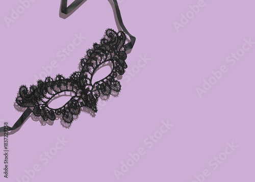 Black Lace Mask For Carnival Or Mardi Gras Celebration on Pastel Purple Background. Concept Of Masquerade Ball Fashion, Mysterious Party Looks, Festive Accessories, Theatrical Costume Styling