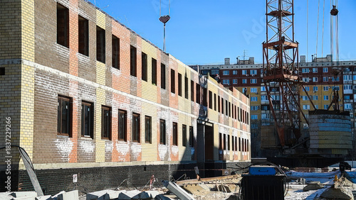 Construction site of an apartment building in winter.
