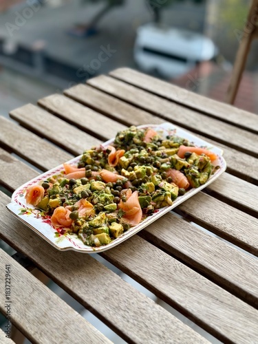 Salad with smoked salmon, avocado, and green leaves. Ideal healthy lunch or dinner concept