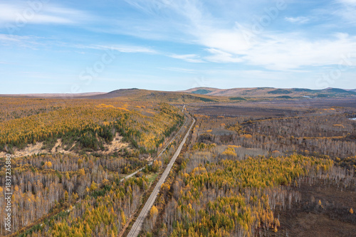 Aerial photography of the autumn forest railway in the Greater Khingan Range