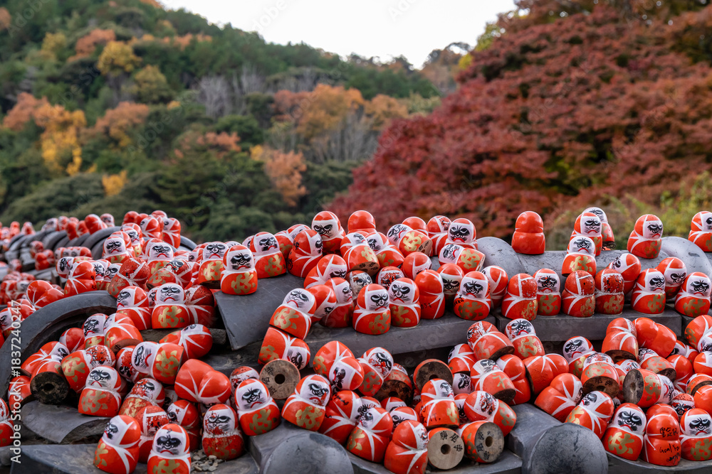 custom made wallpaper toronto digitalColorful daruma dolls on a stone altar in a forested area during autumn