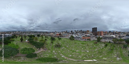 360 aerial photo taken with drone of West Street Cemetery on overcast day in downtown Durban, South Africa
