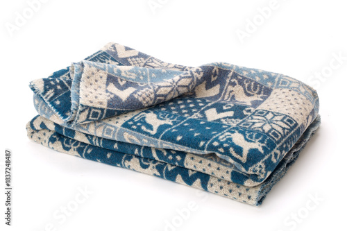 Soft en warm blue wool blanket with winter and christmas motifs isolated on white background