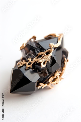 Wallpaper Mural A geometric gem with sharp edges and black surface sits isolated against a white background. Gold filigree accents wrap around the gem, enhancing its unique shape and design Torontodigital.ca