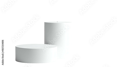 Two white cylindrical platforms of different heights are featured against a solid black backdrop. One lies flat