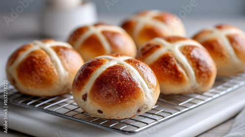 Easter baking tradition with freshly baked hot cross buns on cooling rack