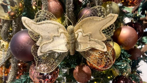 Beautiful Christmas decorations with colorful glowing Christmas balls, flowers, and butterflies. Perfect for backgrounds and Christmas-themed wallpapers