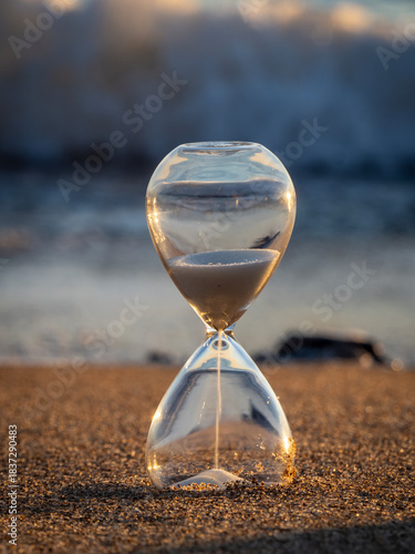 Hourglass on the sand of Tavernes de Valldigna beach (Valencia-Spain)