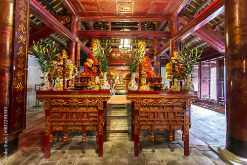 Canvas Print Ornate red and gold wooden altar with Confucius statue and offerings inside the