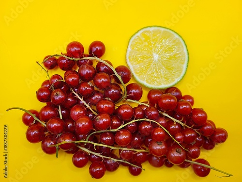 Bunch of red currant and sliced lime