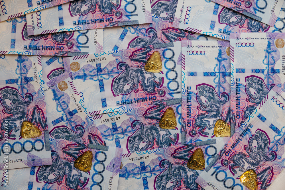 Fototapeta premium 10,000-tenge banknotes are laid out on the table