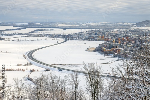 Stary Jicin castle ruins viewpoint. Snow-covered road bypass around Nova Jicin. Czech Republic.