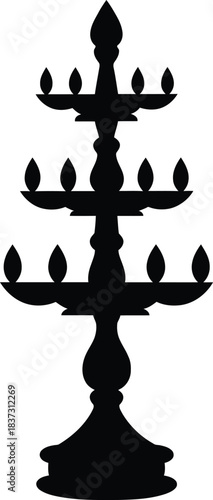 Elegant silhouette of a traditional Indian tiered oil lamp stand, an iconic symbol of spiritual light, cultural heritage, and festive celebrations