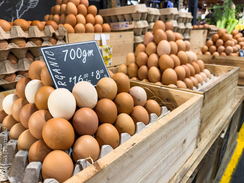 Organic eggs stacked at a market