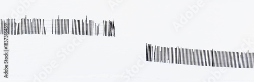 black and white silhouette of broken snow fence on snowy hillside