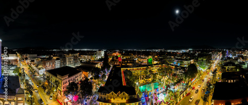The Night Lights of Downtown Riverside, California from  a UAV Drone Aerial view with the horizon in the background during the Christmas Holiday Season.