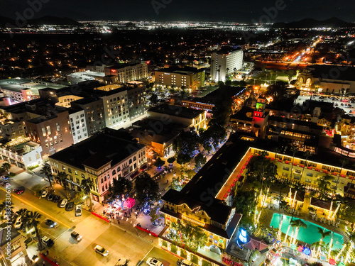 The Night Lights of Downtown Riverside, California from  a UAV Drone Aerial view with the horizon in the background during the Christmas Holiday Season.