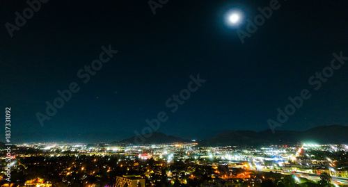 The Night Lights of Downtown Riverside, California from  a UAV Drone Aerial view with the horizon in the background during the Christmas Holiday Season.