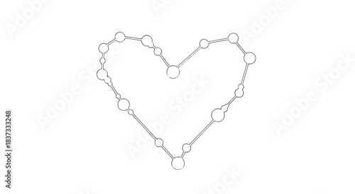 Delicate beaded heart outline made from tiny pearls and string on white background.