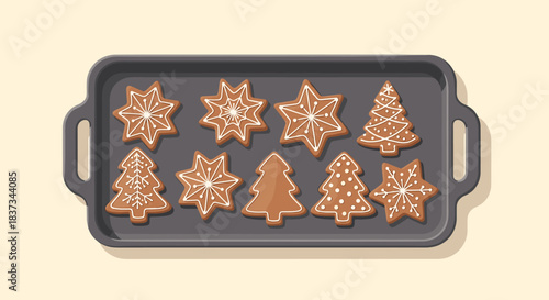 Festive christmas cookies on baking tray with icing decorations