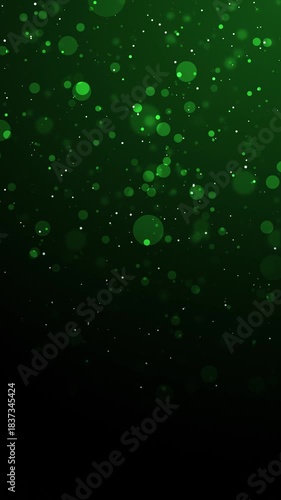 Green glitter particles background with shining neon dust going up and light flare or glare overlay effect above for luxury premium product design or award template backdrop Magical radiance loop