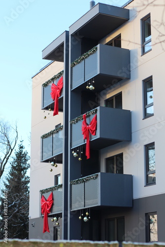 Festive view of decorated building during holiday season. 