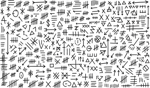 Intricate pattern of hand drawn primitive symbols and ancient markings on white background