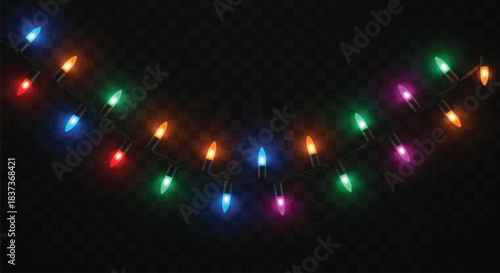 A close-up view of a string of incandescent or LED Christmas lights featuring various colors such as red, green, blue, and magenta, illuminated against a deep black, checkered background.