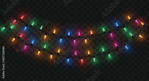 A close-up view of a string of incandescent or LED Christmas lights featuring various colors such as red, green, blue, and magenta, illuminated against a deep black, checkered background.