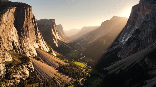 Majestic yosemite valley at sunrise with golden light rays