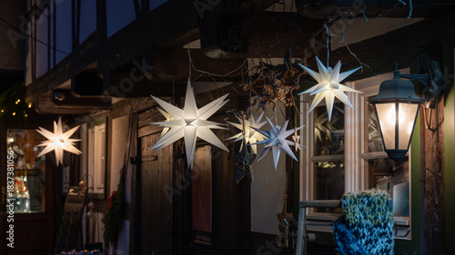 White Christmas stars in fron of a half-timbered house