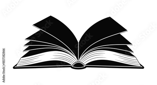 An open book with fanned pages a striking black silhouette