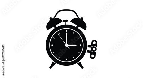 A black silhouette of a classic alarm clock showing time