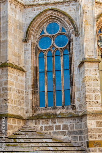 One of the Gothic stone windows of the apse of Palencia Cathedral, Spain.