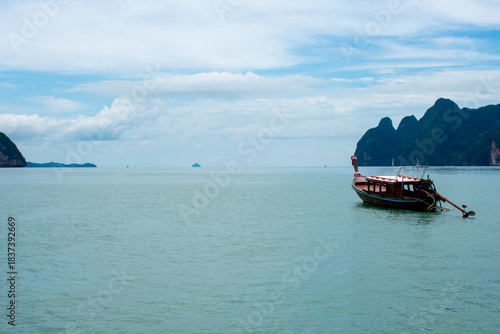 Beautiful tropical landscape, Andaman sea and islands near Phuket in Thailand. James Bond or Khao Phing Kan Island and Boats on sea water