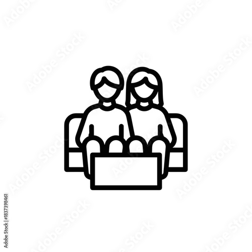 Couple sitting together on sofa enjoying leisure time  