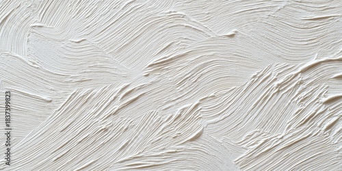An abstract, high-key close-up captures the dramatic, rhythmic brushstrokes of thick plaster or white paint applied in sweeping curves.