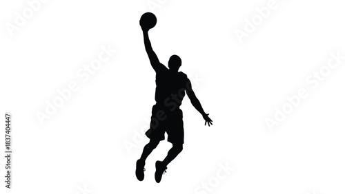 Silhouette of a basketball player in mid air preparing to shoot