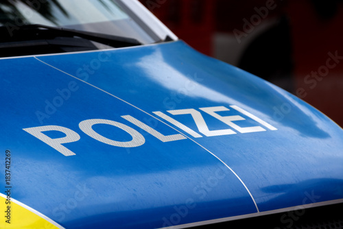 A close-up of the hood of a German police car with the inscription 