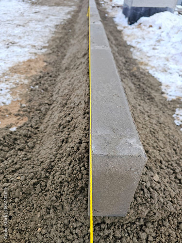 Concrete curb on the ground in a construction site