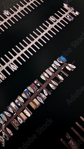 4K aerial vertical footage of boats and yachts docked on the waters in Marina at Lake Lanier in Buford, Georgia