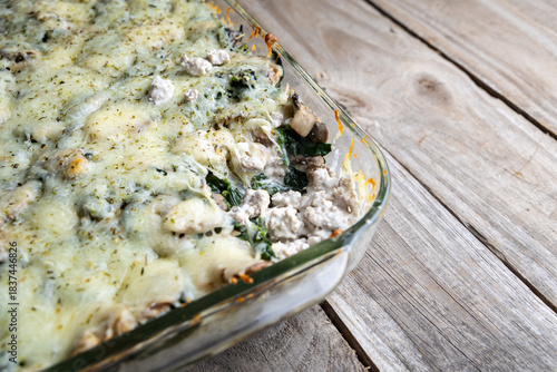 Healthy low-carb turkey, spinach, and mushroom bake in a casserole dish. Fresh, high-protein meal prep recipe with baked vegetables.