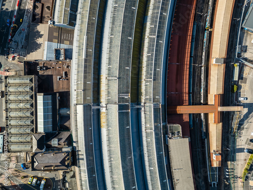 Train station and railway tracks aerial birds eye view