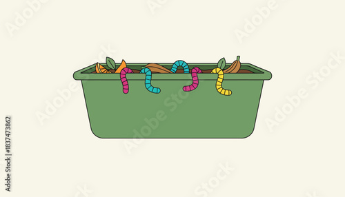 An indoor composting setup featuring a worm bin with colorful worms wriggling amidst food scraps.