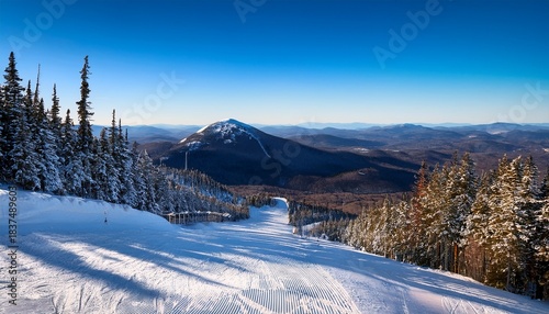 killington peak in vermont ski slopes leading to forested mountain ridges and rolling valleys