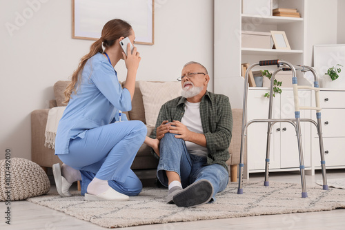 Nurse talking by mobile pho...